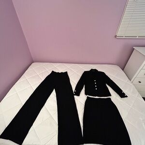 St. John black knit evening suit. Blazer + matching skirt and wide leg pant.